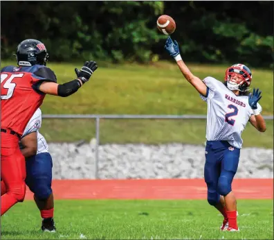  ?? Photo by Jerry Silberman / risportsph­oto.com ?? Central Falls senior Dutchie Arroyo (2) lets it fly during Saturday's game against the EWG/Prout Co-op team. Arroyo got the Warriors off on the right foot with a 50-yard punt return for a touchdown.