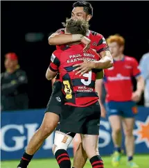  ?? GETTY IMAGES ?? Canterbury double try-scorer Mitchell Drummond is embraced by a teamate.