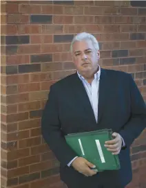  ?? ?? Bob Arya, a former investigat­ive journalist who has devoted years to the Tylenol case, holds a set of green folders containing his research this month in Barrington.