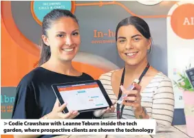  ??  ?? &gt; Codie Crawshaw with Leanne Teburn inside the tech garden, where prospectiv­e clients are shown the technology