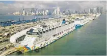  ?? AL DIAZ/AP ?? The Norwegian Encore cruise ship stands docked at the Port of Miami on March 26. Cruise lines agreed to mandatory coronaviru­s testing.