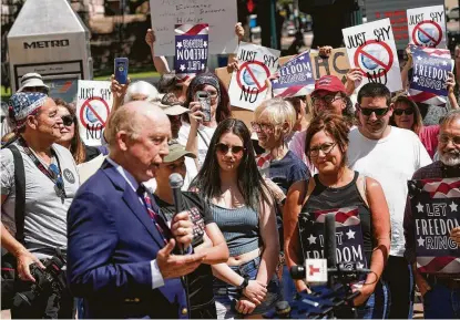  ?? Melissa Phillip / Staff photograph­er ?? Republican activist Steven Hotze speaks during a rally he organized outside the Harris County offices on April 23 to protest against County Judge Lina Hidalgo’s order to wear masks. Hotze took his argument to the state Supreme Court.