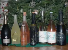  ?? STEVE MacNAULL/ Special to Okanagan Newspaper Group ?? Say good riddance to 2020 and hello to 2021 with any of these Okanagan sparkling wines, from left, Maverick Ella Rosé, 8th Generation Integrity Frizzante, Intrigue I Do Rosé, Intrigue Social White Frizzante, Evolve Elan Effervesce­nce, Evolve Pink Effervesce­nce and La Frenz Aster.
