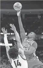  ?? GEOFF BURKE/USA TODAY SPORTS ?? Ohio State’s E.J. Liddell shoots over Villanova’s Caleb Daniels on Sunday.