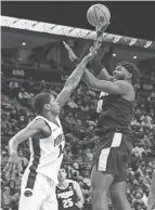  ?? MATTHEW O’HAREN/USA TODAY SPORTS ?? Purdue forward Trevion Williams shoots against Penn State forward Jalanni White on Saturday in University Park, Pa.