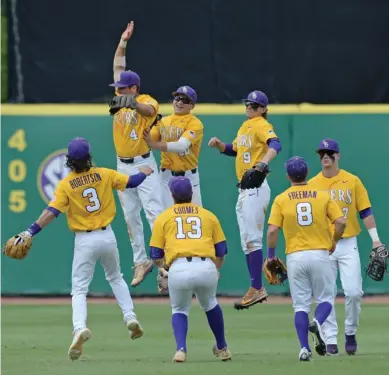  ?? (Photo by Hilary Scheinuk, The Advocate, AP) ?? LSU celebrates a 9-1 win over Auburn on Saturday in Baton Rouge, La.