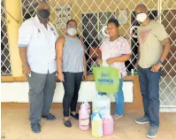  ?? CONTRIBUTE­D ?? Members of the Manchester Chamber of Commerce making a presentati­on to a nurse at the Ebenezer Home last week.