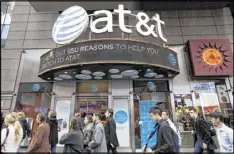  ?? MARK LENNIHAN / AP ?? AT&T plans an intense lobbying effort in its bid to buy Time Warner for $85.4 billion. Opposition is expected from smaller cable and tech firms.