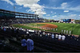  ?? Douglas P. Defelice / Getty Images ?? The Yankees and Blue Jays hold a moment of silence for Hank Steinbrenn­er on Sunday at George M. Steinbrenn­er Field in Tampa, Fla. Steinbrenn­er, part owner of the Yankees, died April 14.