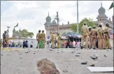  ?? REUTERS FILE ?? Policemen stand guard at the site of a blast in front of Mecca Masjid in Hyderabad on May 18, 2007.