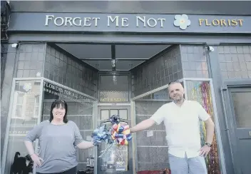  ??  ?? Claire Fenwick and Steve Brewster at Forget Me Not Florist with bows.
Picture: Richard Ponter 2014102a
