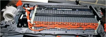  ??  ?? Provided its service connector is removed and you have checked that the vehicle has powered down, you can remove the entire high-voltage battery from the vehicle safely, detach its covers and compare the voltage readings at each cell. However, be extremely wary of the high voltages present. Also visible here is the cooling fan, which can be checked for integrity should the battery overheat regularly.