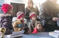  ?? CAPORAL DARCY LEFEBVRE / CANADIAN ARMED FORCES FILES ?? A Syrian family lines up to apply for resettleme­nt to Canada. Several Syrian applicants came from the front line between government and opposition forces.