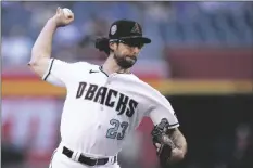  ?? AP PHOTO/ROSS D. FRANKLIN ?? Arizona Diamondbac­ks starting pitcher Zac Gallen throws against the Colorado Rockies during the first inning of a baseball game on Tuesday in Phoenix.