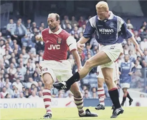  ??  ?? Jorg Albertz gets in front of Arsenal defender Steve Bould to score for Rangers in Richard Gough's testimonia­l match at Ibrox in 1996