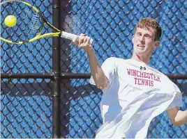  ?? STAFF PHOTO BY MATT STONE ?? SUCCESSFUL RACKET: Noah Criss returns a shot during his first singles victory yesterday against Duxbury’s Ethan Hall while leading Winchester to the Division 2 state championsh­ip.