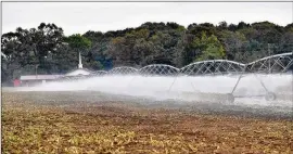  ?? HYOSUB SHIN / HYOSUB.SHIN@AJC.COM ?? Sprinklers irrigate Worsham Farms in Vada in southwest Georgia last month. The focus of Florida’s water rights suit against Georgia has shifted from metro Atlanta to the farmland of southwest Georgia.