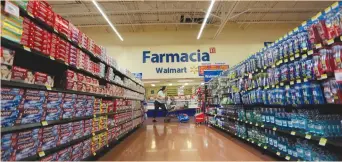  ?? (Reuters) ?? A CUSTOMER shops at a Walmart in Monterrey, Mexico.