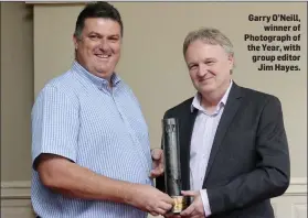  ??  ?? Garry O’Neill, winner of Photograph of the Year, with group editor Jim Hayes.