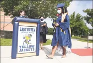  ?? Arnold Gold / Hearst Connecticu­t Media ?? A’Maya Ashante Bell, who graduated with honors, walks a red carpet on her way to receiving a diploma at the East Haven High School graduation ceremony in front of the school on Saturday.