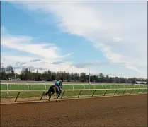  ?? LAUREN HALLIGAN LHALLIGAN@DIGITALFIR­STMEDIA.COM ?? A horse running on the historic Oklahoma Training Track on will open on Thursday, to essential personnel.