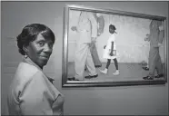  ?? STEVE UECKERT/HOUSTON CHRONICLE VIA AP, FILE ?? Lucille Bridges poses July 20, 2006, next to the original 1964 Norman Rockwell painting, “The Problem We
All Live With,” showing her daughter Ruby, inside the Museum of Fine Arts in Houston. Bridges, a Hurricane Katrina evacuee and Houston resident after the storm, looked for the first time at the Rockwell original capturing her oldest daughter, Ruby, as she was escorted by U.S. marshals into an all-white New Orleans school during integratio­n nearly a half-century earlier.