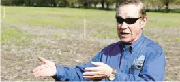  ?? ?? Cedar Lake Councilman Bob Carnahan, describes the process of dredging Cedar Lake during a tour of the area where the new de-watering location at 152nd and Parrish will be during