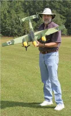  ?? ?? Longtime MAN contributo­r Greg Gimlick has done it all when it comes to electric-powered airplanes. Here, he is showing off his twin powered Durafly WW II Messerschm­itt Bf 110 night fighter/bomber.