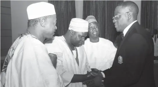  ??  ?? From left, newly sworn-in Kwara State Civil Service Commission members Alhaji Isiaka Labaika, Alhaji Abubakar Gunu Zikki; Chairman, Alhaji Salman Adelodun Ibrahim and Governor Abdulfatah Ahmed of Kwara (right), after the swearing-in ceremony at...