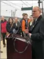  ??  ?? State Rep. Thomas Quigley, R-146, far right, speaks on Friday about the completion of new bicycle lanes on three suburban state highways in the Philadelph­ia region by PennDOT as part of a pilot effort to integrate bicycle facilities into regional...