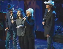  ?? ANDREW NELLES/THE TENNESSEAN VIA AP ?? George Strait, left, Loretta Lynn, second from left, and Connie Smith join Alan Jackson, right, in singing "Will the Circle Be Unbroken" during Jackson's induction into the Country Music Hall of Fame on Sunday, in Nashville, Tenn.