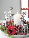  ?? ?? Reindeer sculptures on a bed of red berries