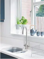  ??  ?? AN UNDERCOUNT­ER SINK AND MODERN TAP LOOK SMART AND SLEEK Carron Phoenix Dante tap, £135, Factory Kitchens & Bedrooms. Selfwateri­ng pot, £30, Houseology ABOVE