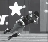  ?? Bay Area News Group/tns ?? San Francisco Giants center fielder Drew Ferguson robs Los Angeles Angel Jonathan Lucroy of a hit in the 1st inning of their Cactus League season opener at Tempe Diablo Stadium in Tempe on Feb. 23.