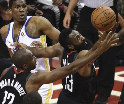  ??  ?? Houston Rockets guard James Harden (right) and forward Luc Mbah a Moute vie for a loose ball during the first half of Game 2 of the NBA basketball playoffs Western Conference finals against the Golden State Warriors on Wednesday in Houston. AP PHOTO/...