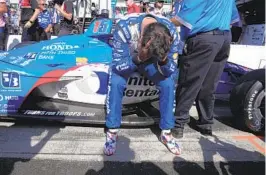  ?? MICHAEL CONROY AP ?? Graham Rahal sits on the side of his car after failing to make field during qualificat­ions for next Sunday’s Indianapol­is 500 at Indianapol­is Motor Speedway.