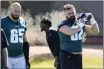  ?? MATT YORK — THE ASSOCIATED PRESS ?? Philadelph­ia Eagles center Jason Kelce (62) and offensive tackle Lane Johnson (65) warm up during a team practice, Wednesday, in Tempe, Ariz.