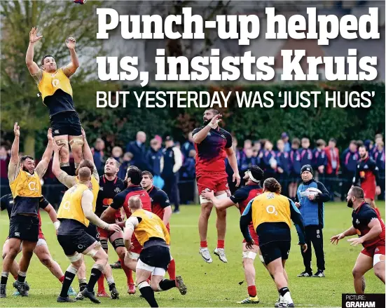  ??  ?? High and flighty: England lock Charlie Ewels leaps to catch a lineout throw against Georgia as Jones looks on