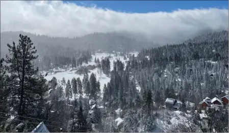  ?? PHOTO COURTESY OF VIRA KRASIUK ?? Lake Arrowhead was still blanketed by several feet of snow Monday, with road closures into the community and others nearby keeping residents and travelers from leaving.