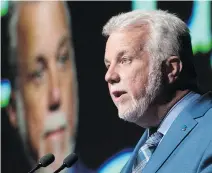  ?? JACQUES BOISSINOT/THE CANADIAN PRESS ?? Liberal Leader Philippe Couillard said Friday that if he’s re-elected, he would meet with municipali­ties to look at how their taxation powers can be adjusted to modern realities.