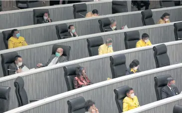  ?? CHANAT KATANYU ?? Senators don masks and sit a safe distance from each other during the first Upper House session after parliament reconvened yesterday.