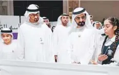  ?? WAM ?? Shaikh Mohammad Bin Rashid and Shaikh Mohammad Bin Zayed interact with child participan­ts during the concluding day of the Annual Government Meetings yesterday.