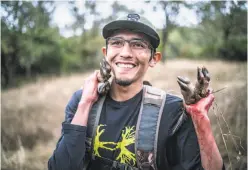  ??  ?? Brian Nez carries the bounty from a hunt at Sherwood Rancheria. His young son accompanie­d him on the hunt for the first time.