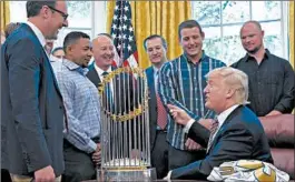  ?? SUSAN WALSH/AP ?? President Donald Trump meets with 2016 World Series Champions Chicago Cubs on June 28, 2017, in the Oval Office. Cubs Chairman Tom Ricketts is at center and Cubs co-owner Todd Ricketts is at left.