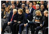  ??  ?? From left: First lady Melania Trump and President Donald Trump; German Chancellor Angela Merkel; French President Emmanuel Macron and wife Brigitte; and Russian President Vladimir Putin at the ceremony.