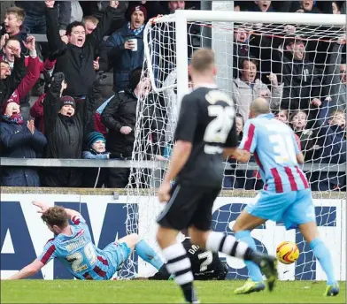  ??  ?? YOU CAN’T WINNALL: Sam Winnall slides home to put Scunthorpe into a 1-0 lead