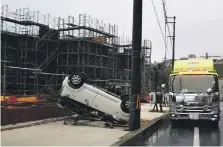  ?? Photos EPA ?? An overturned car in Kitanakagu­suku, Okinawa, after Typhoon Trami made its presence felt in the area on Saturday