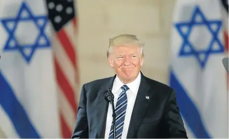  ?? /AFP Photo ?? Diplomatic disaster: US President Donald Trump, pictured here speaking during a visit to the Israel Museum in Jerusalem in May 2017, was warned against recognisin­g the ancient walled city as Israel’s capital and moving the US embassy there from Tel Aviv.