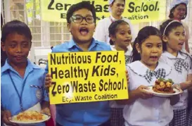  ??  ?? A mouthful: Kids of Sto. Cristo Elementary School in Bago Bantay, QC enjoy healthy, nutrient-rich food.