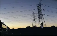  ?? KAREN SANDISON ?? Pylons are silhouette­d against the start of evening sky near the Corlett Drive off-ramp. African News Agency (ANA) |
